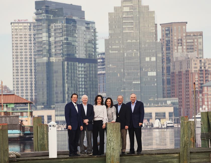 H&S Bakery Senior and Executive Paterakis Family Leadership & Management in front of the Baltimore Harbor