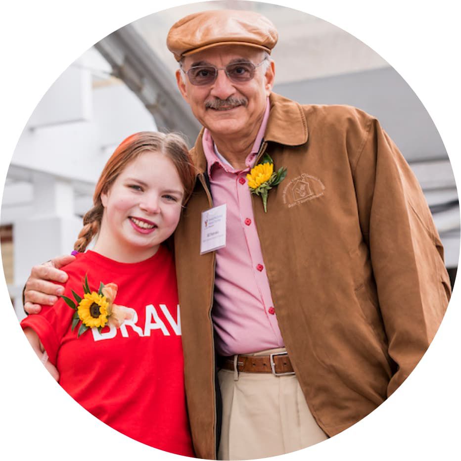 Bill Paterakis taking a picture with non profit organization volunteer in Baltimore, Marlyand